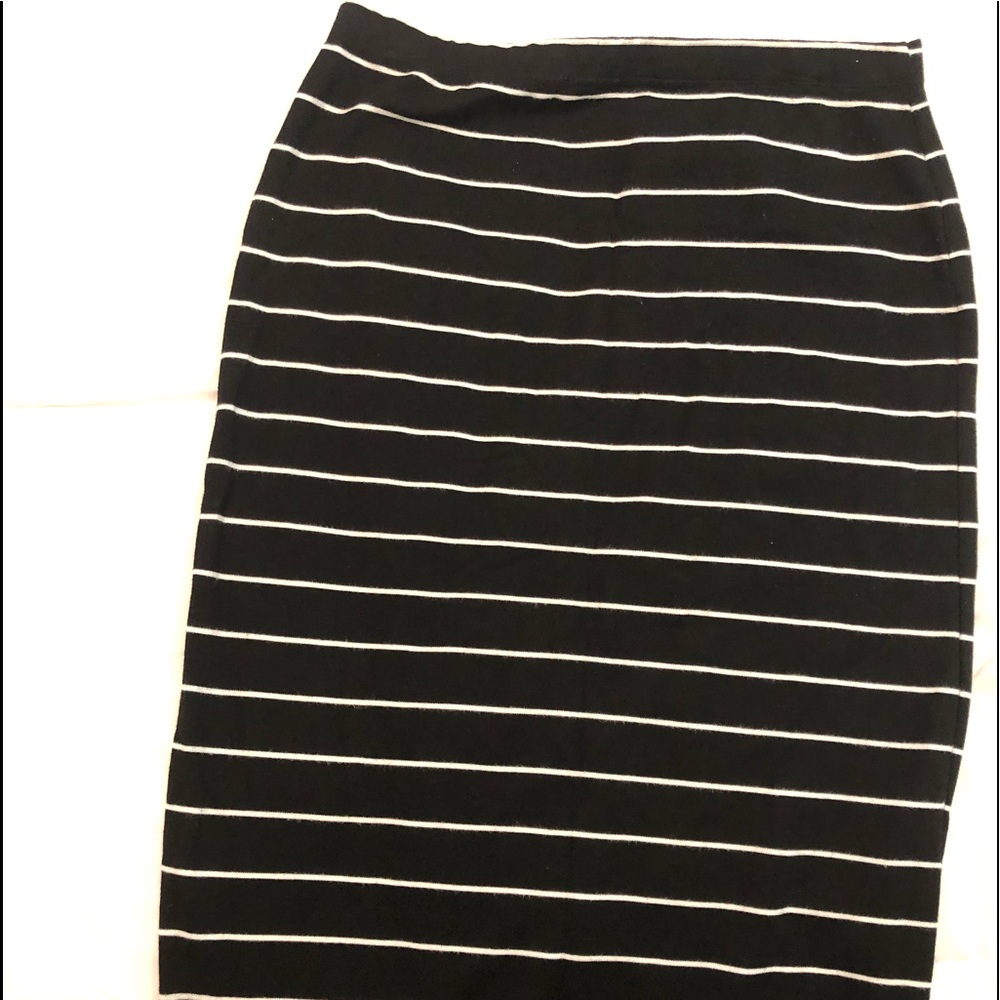 Black tunic top and stripped pencil skirt